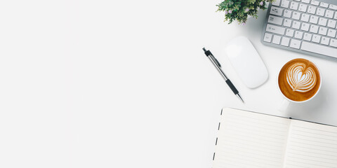 Office desk with keyboard computer, pen, notebook, Cup of coffee on white background, Top view with...
