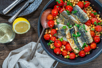 Sardines with chickpeas, cherry tomatoes, lemon and parsley