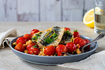 Sardines with chickpeas, cherry tomatoes, lemon and parsley