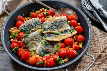 Sardines with chickpeas, cherry tomatoes, lemon and parsley