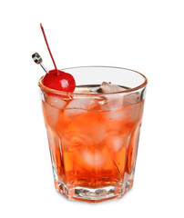 Glass of tasty Manhattan cocktail with cherry and ice on white background