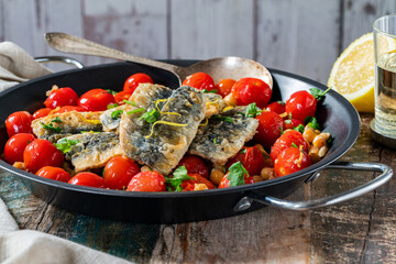 Sardines with chickpeas, cherry tomatoes, lemon and parsley