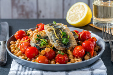 Sardines with chickpeas, cherry tomatoes, lemon and parsley