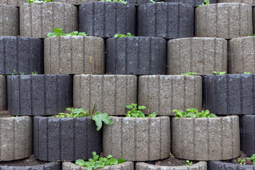 wall of concrete pots as park decoration