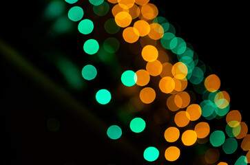 abstract background of green and orange colorful lights
