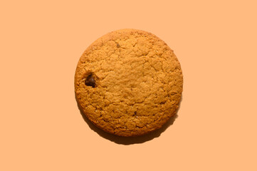 Oatmeal cookies on a beige background. Diet food. Close-up.