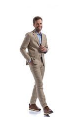 sexy businessman laughing and feeling good, walking