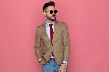 sexy smart casual man holding one hand in pocket