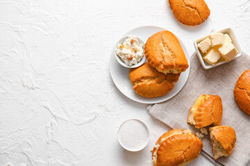 Plate of tasty sochniki with cottage cheese on white background