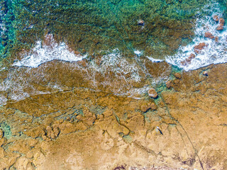 Aerial view of a man standing by the sea