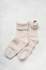 Knitted socks on light background
