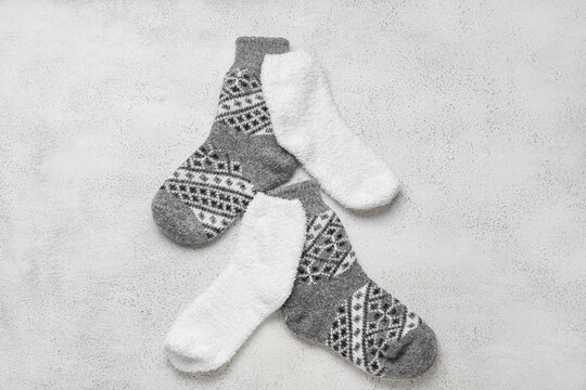 Two Pairs Of Warm Socks On Light Background