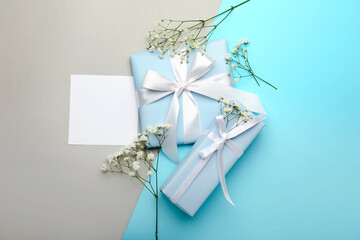 Composition with blank card, gift boxes and gypsophila flowers for International Women's Day...