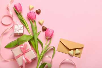 Composition with tasty heart-shaped candies, envelope and flowers for Valentine's Day celebration...