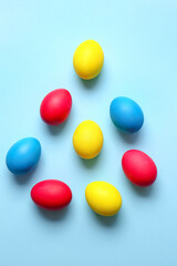 Multicolored Easter eggs on color background