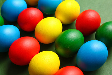 Multicolored Easter eggs on color background