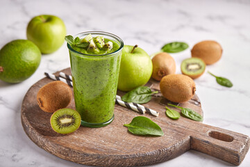 Detox smoothie with kiwi fruit, green apples, avocado and spinach. Healthy diet organic beverage.