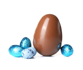 Chocolate Easter egg and candies isolated on white background