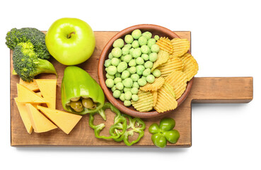 Wooden board with different products for St. Patrick's Day celebration on white background