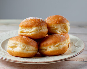 European Indulgence: Cream-Filled Krapfen and Berliner, Pastry Perfection from Austria and Germany. On white table. Selective focus.