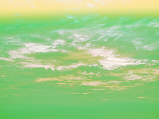 Obraz na płótnie Canvas beauty sweet pastel green yellow colorful with fluffy clouds on sky. multi color rainbow image. abstract fantasy growing light