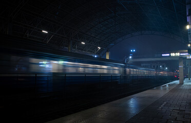train at the station in the night fog - Powered by Adobe