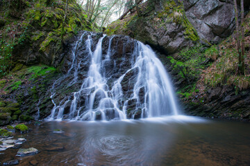 Fototapeta na wymiar waterfall in the forest Shetlands Scotland Travel