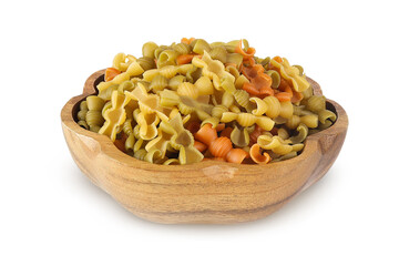 Colored pasta on an isolated white background. Pasta in a wooden bowl