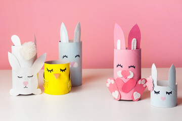 DIY bunny for kids Art from paper tube. Easter home activities. Handmade cute toy rabbits and chicken. Reuse concept