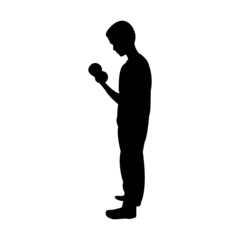 Silhouette of male kid working out with dumbbells
