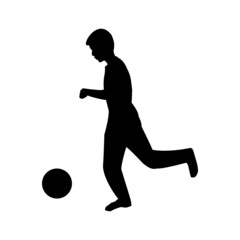 Silhouette of male kid playing football / soccer