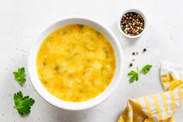 Summer squash yellow vegetable soup. Top view, copy space.