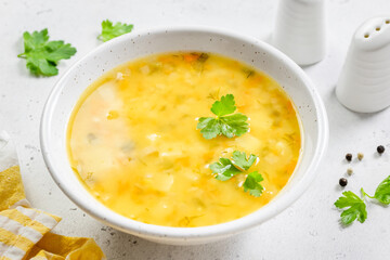Roasted summer squash yellow vegetable soup. Top view, copy space.