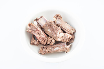 Steak ribs in a bowl of blanching on a white background