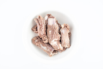 Steak ribs in a bowl of blanching on a white background