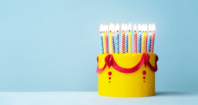 Colorful Yellow Birthday Cake With Candles