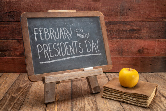 February 3rd Monday, Presidents Day, the birthday of George Washington - white chalk handwriting on a vintage slate blackboard against rustic wood background, education concept