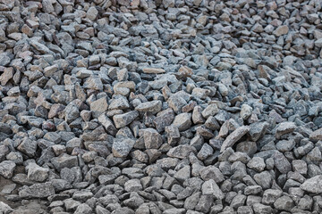 Granite crushed stone or graphy. Building material texture background.