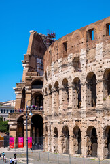 Fototapeta premium Colosseum ancient theater known as Flavian Amphitheatre aside Palatine Hill and Roman Forum Romanum in historic city center of Rome in Italy