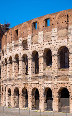 Fototapeta premium Colosseum ancient theater known as Flavian Amphitheatre aside Palatine Hill and Roman Forum Romanum in historic city center of Rome in Italy