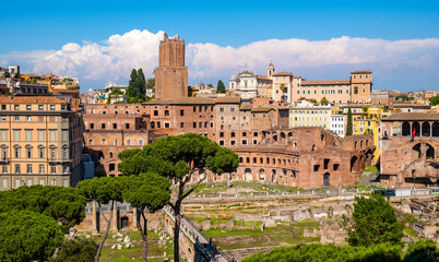 Fototapeta na wymiar Panorama of Roman Forum Romanum with Forum of Caesar and Trajan's Market in historic center of Rome in Italy