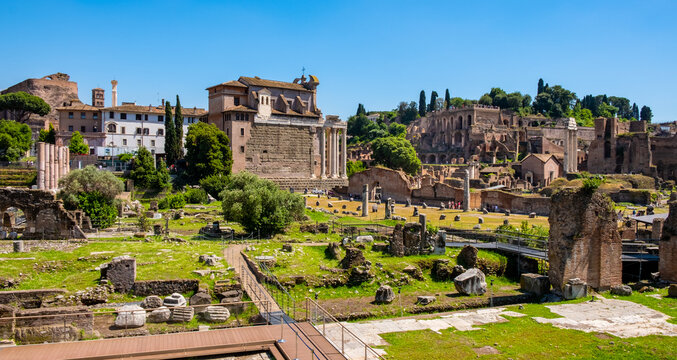 Panorama of Roman Forum Romanum with Temple of Antoninus and Faustina San Lorenzo in Miranda church and Palatine Hill in historic center of ancient Rome in Italy
