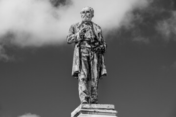 Outdoor bronze statue, monument of Luigi Orlando in Livorno, Tuscany, Italy in black and white