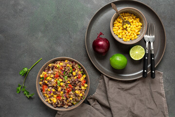 Mexican food, salad with black beans, quinoa and corn. Top view, flat lay.