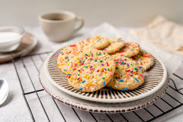 Sugar cookies with sprinkles, colorful coffee treat. freshly baked dessert cookies. 