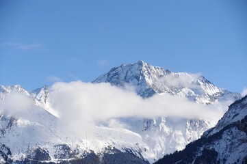Fototapeta na wymiar Cloudscape over the peak of a Mont Blanc 