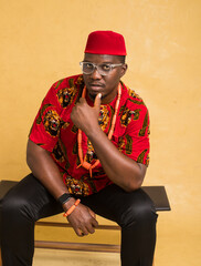 Igbo Traditionally Dressed Business Man Sitting Down and Looking Handsome