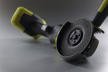 Cordless new hand sander on a gray background