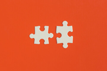 White details of puzzle on red background.