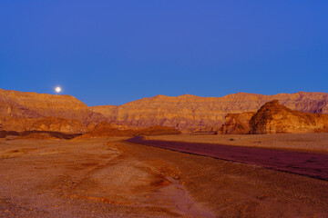 Sunrise of rock formations, and the moon, Timna desert park